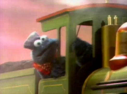 Cookie Monster riding train